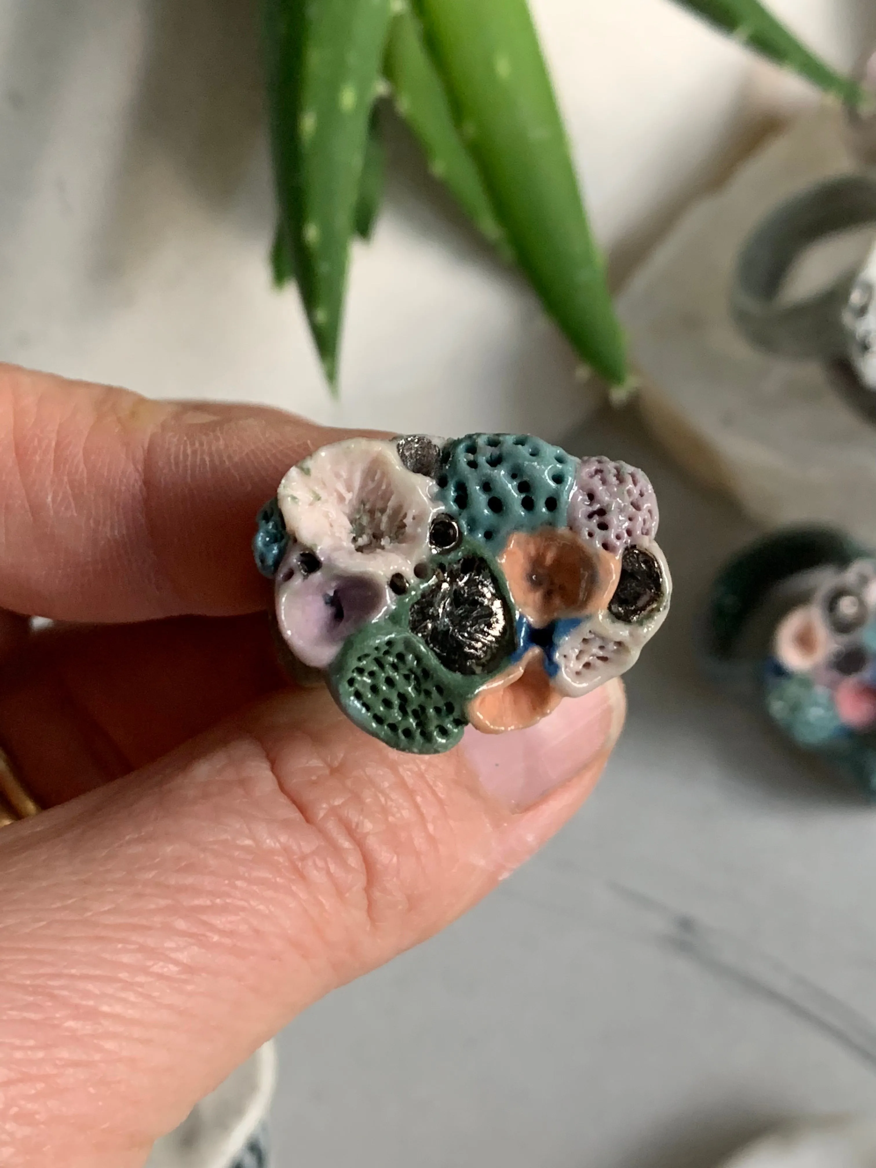 Green tones porcelain ‘rock coral’ ring with platinum detail- larger sizes. choose a size