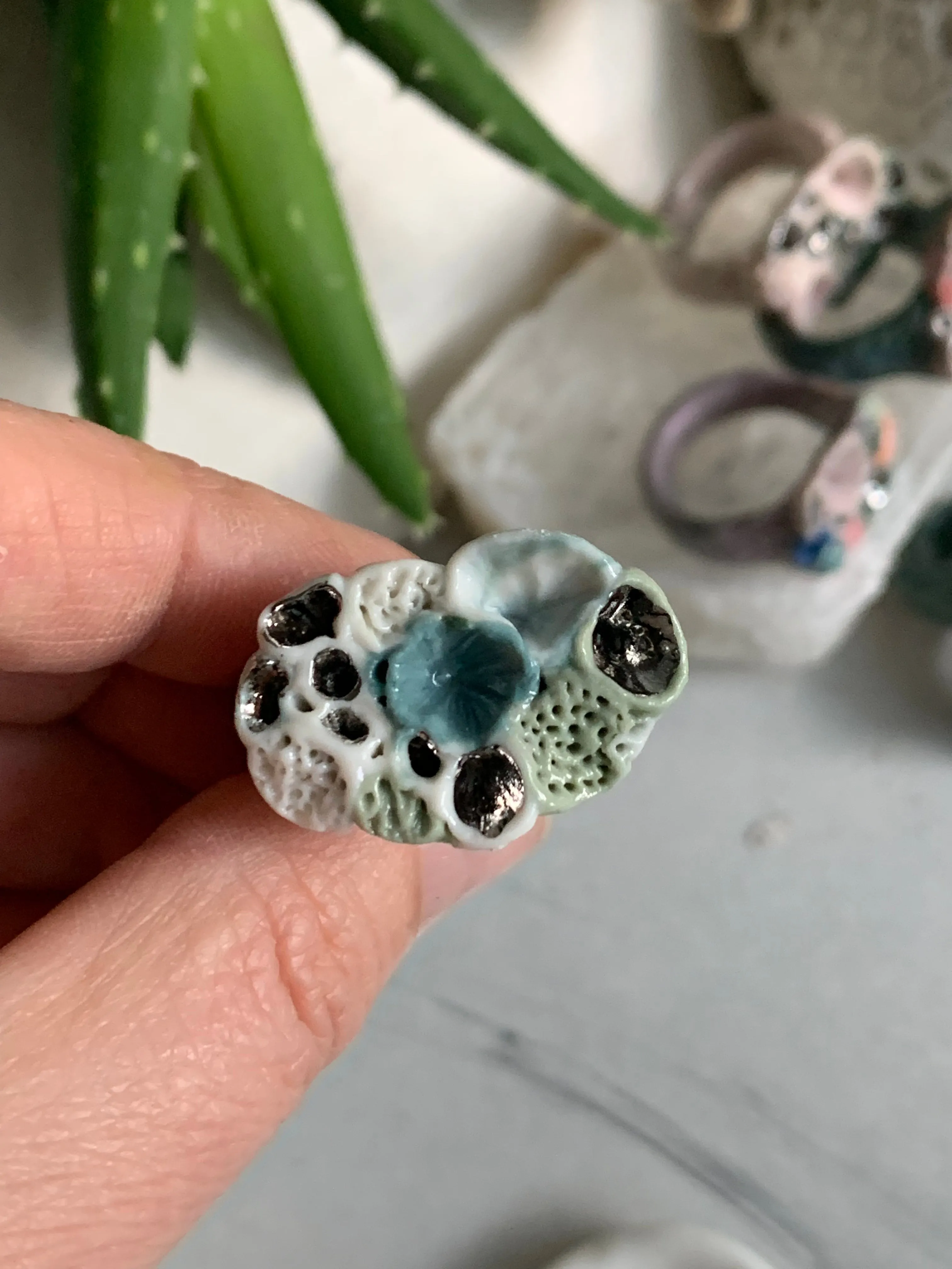 Green tones porcelain ‘rock coral’ ring with platinum detail- larger sizes. choose a size