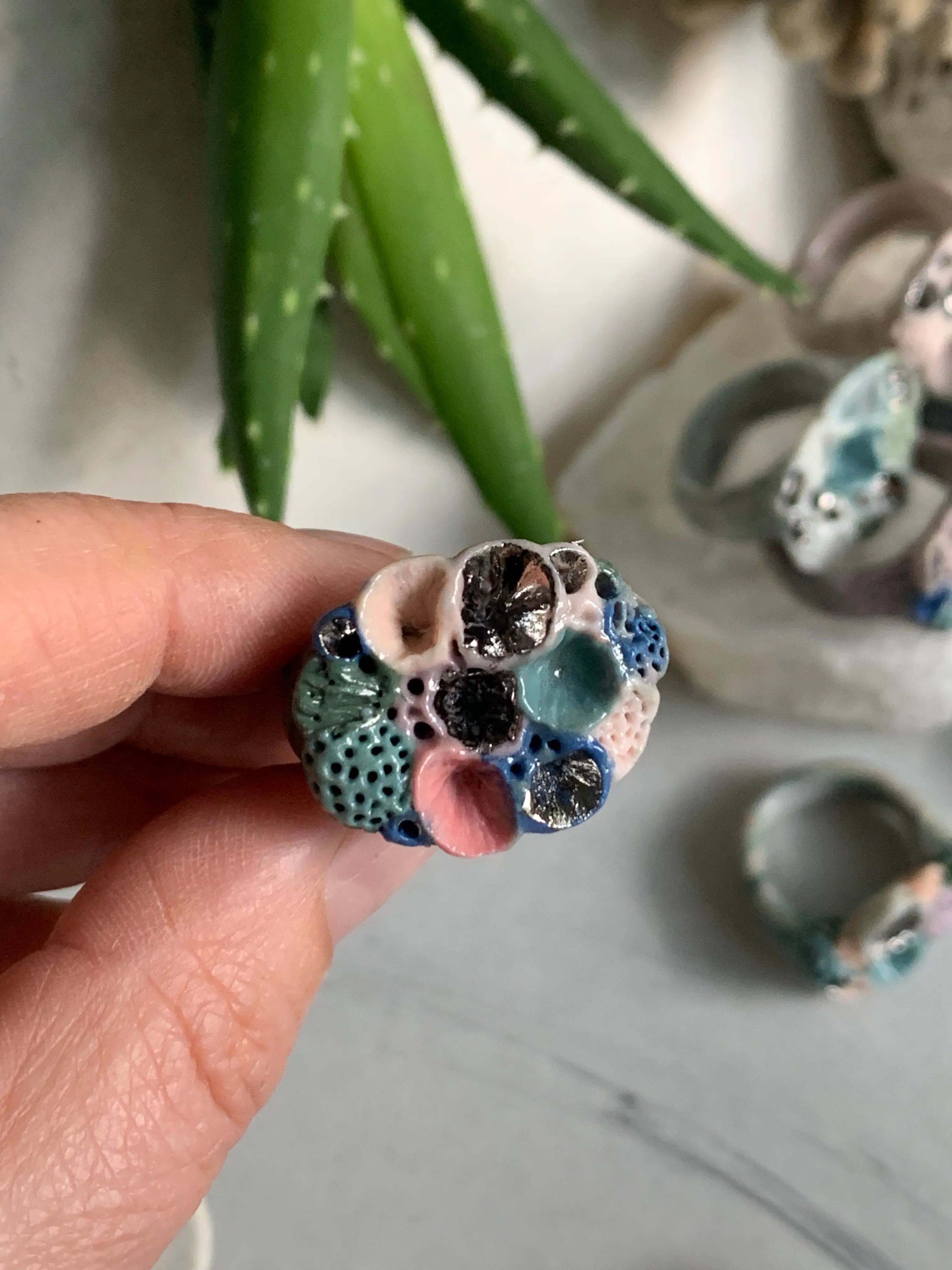 Green tones porcelain ‘rock coral’ ring with platinum detail- larger sizes. choose a size