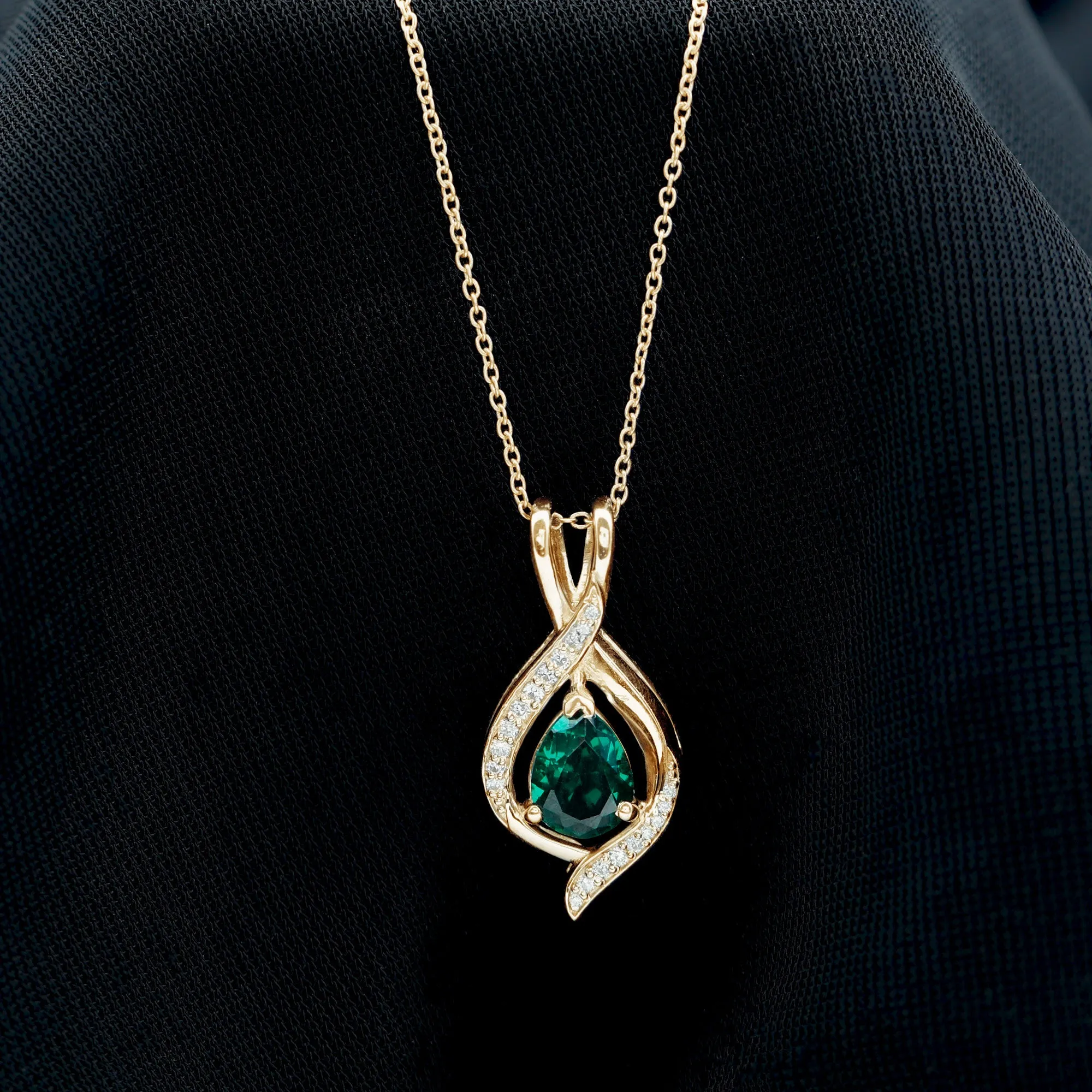 Pear Cut Created Emerald Teardrop Pendant with Moissanite Accent