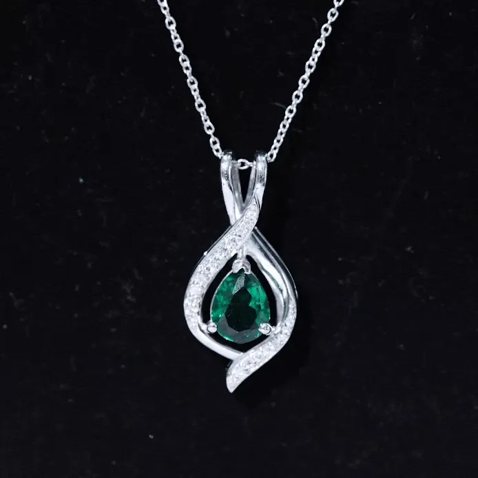Pear Cut Created Emerald Teardrop Pendant with Moissanite Accent